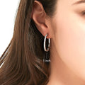 Model wearing Bar CZ Small Hoop Earrings in Sterling Silver, 1 inch