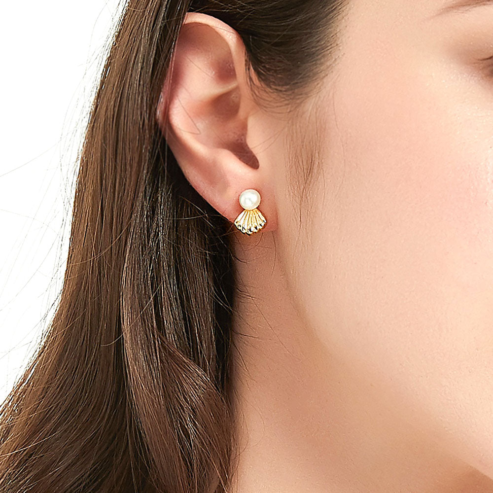 Model wearing Solitaire White Button Cultured Pearl Stud Earrings in Sterling Silver, 2 of 7
