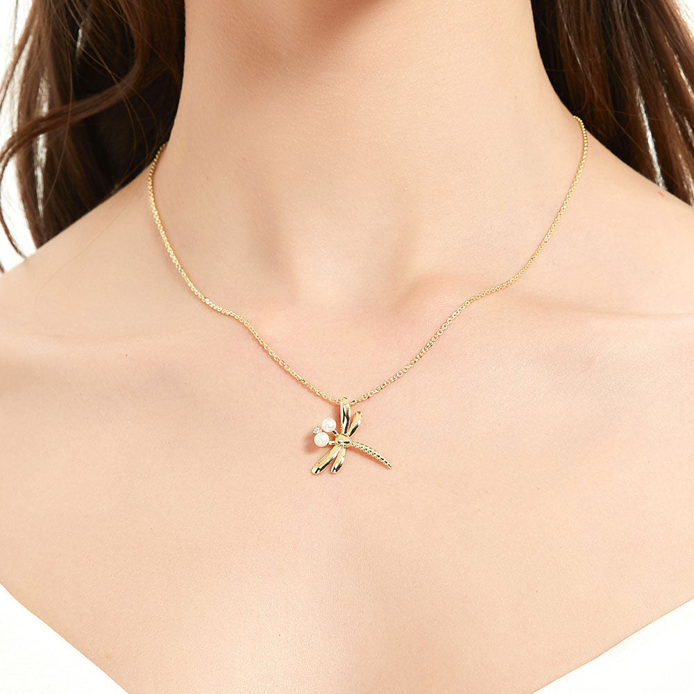 Model wearing Dragonfly White Button Cultured Pearl Necklace in Sterling Silver, 2 of 6