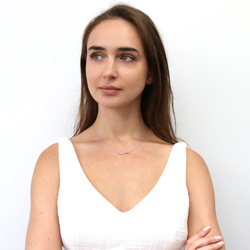 Model wearing Wave Pendant Necklace in Sterling Silver, 6 of 7