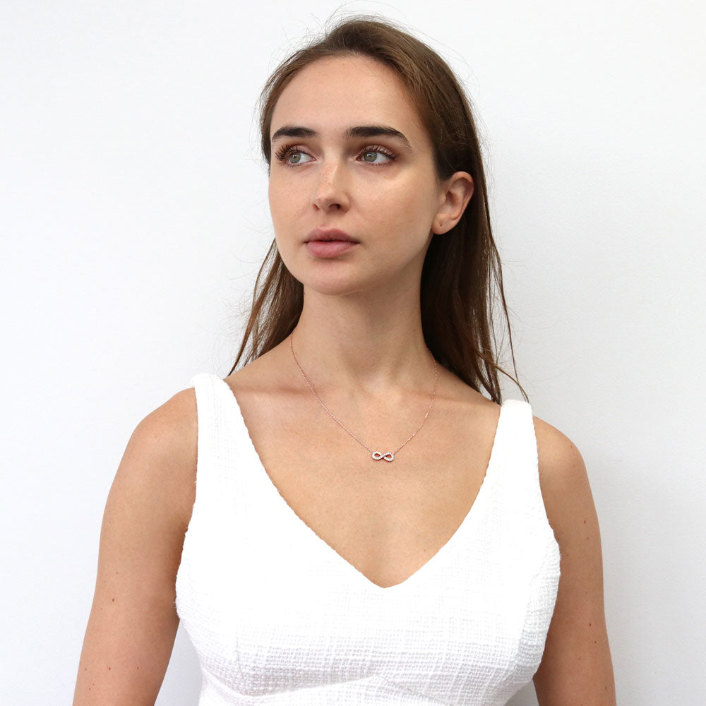 Model wearing Infinity CZ Pendant Necklace in Rose Gold Flashed Sterling Silver, 3 of 6
