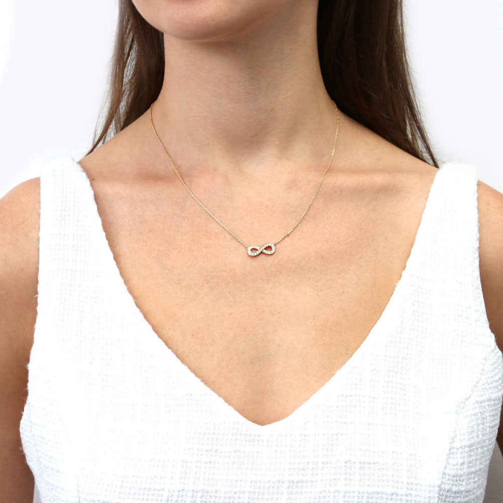 Model wearing Infinity CZ Pendant Necklace in Gold Flashed Sterling Silver, 2 of 6