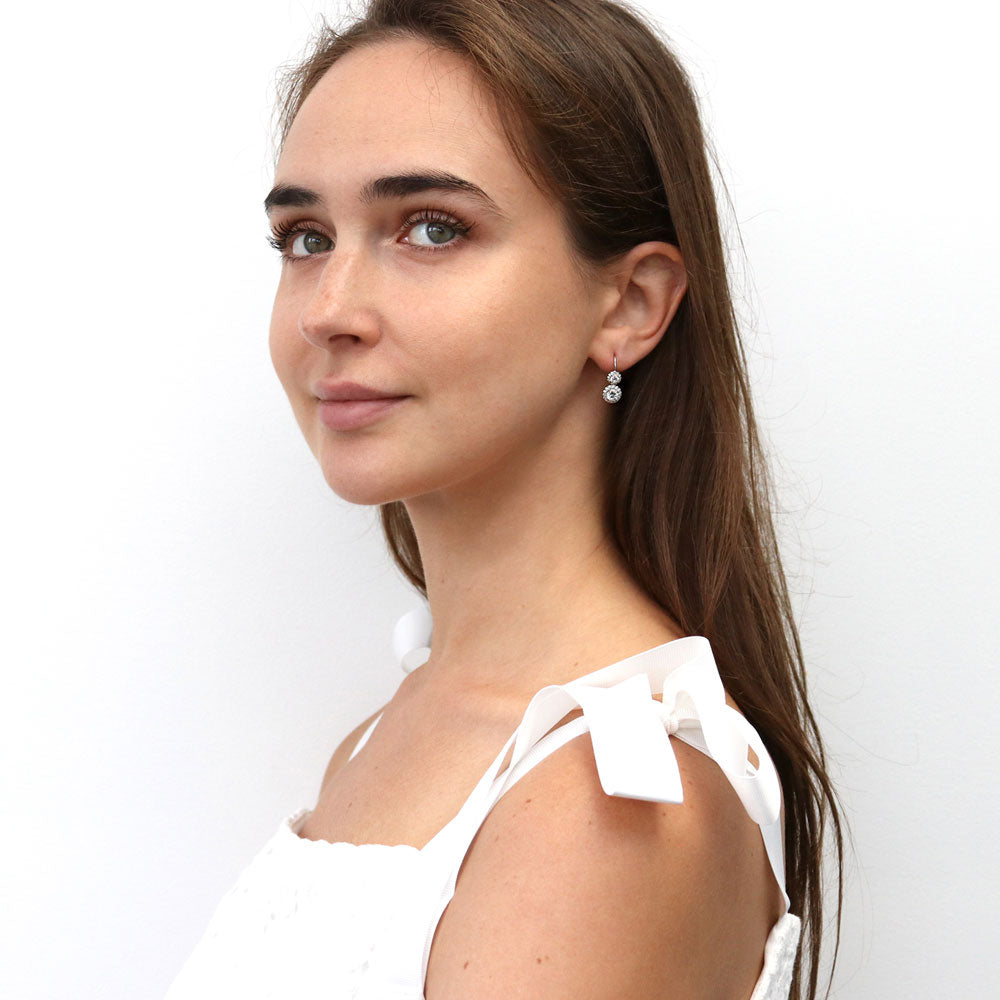 Model wearing Halo 2-Stone CZ Leverback Earrings in Sterling Silver, 3 of 5