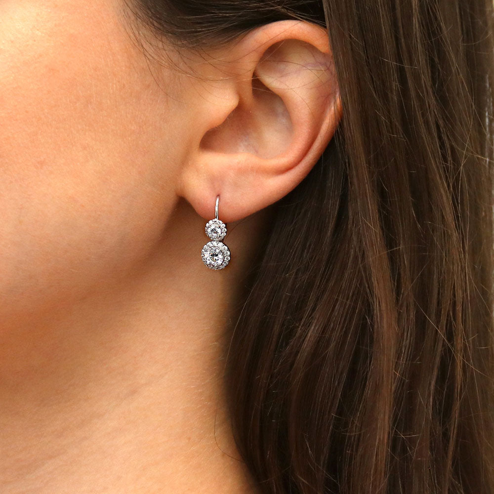 Model wearing Halo 2-Stone Round CZ Leverback Dangle Earrings in Sterling Silver, 2 of 5