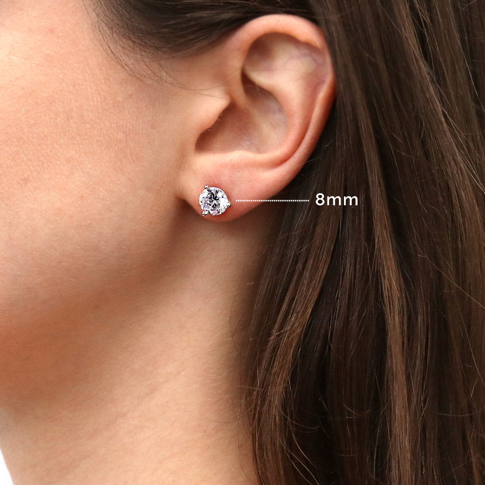 Model wearing Solitaire Round CZ Stud Earrings in Sterling Silver, 4 of 9