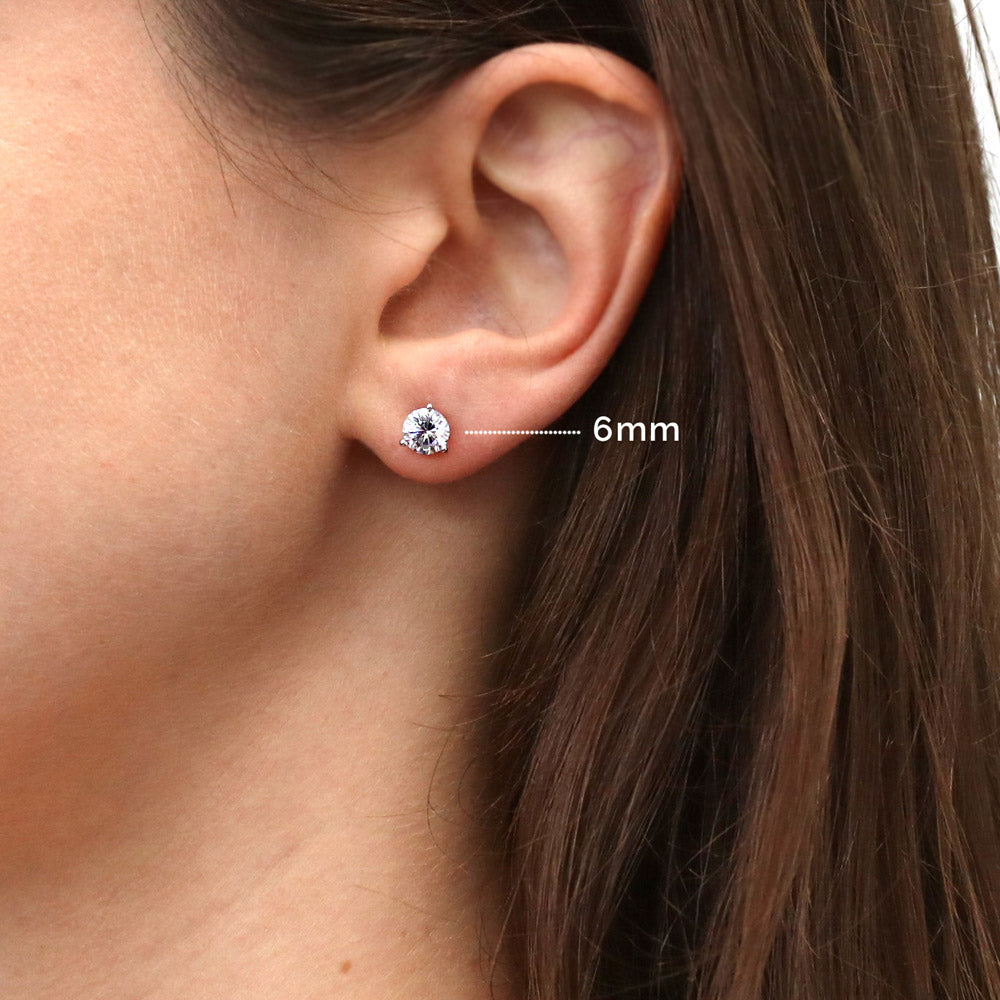 Model wearing Solitaire Round CZ Stud Earrings in Sterling Silver, 6 of 9