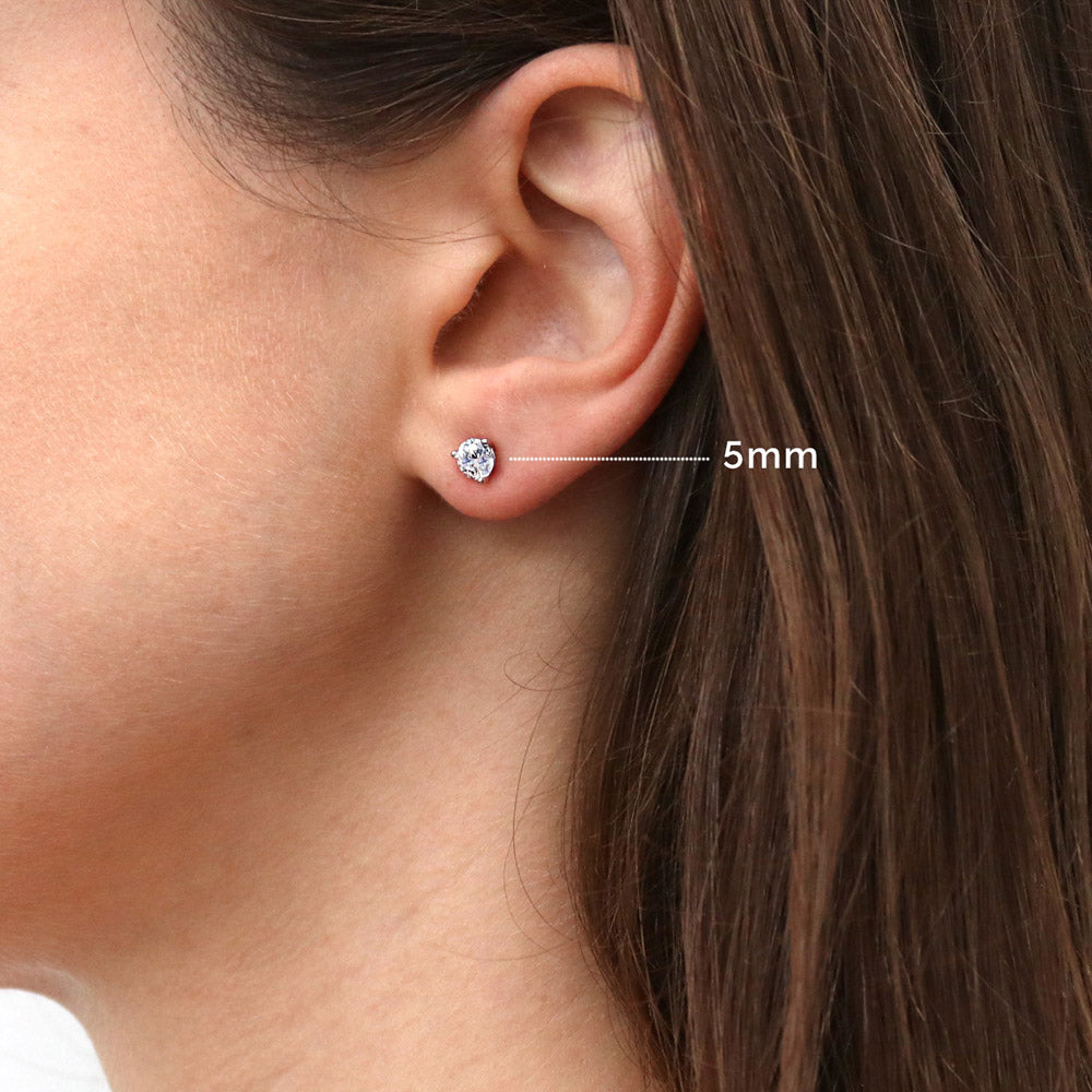 Model wearing Solitaire Round CZ Stud Earrings in Sterling Silver, 7 of 9