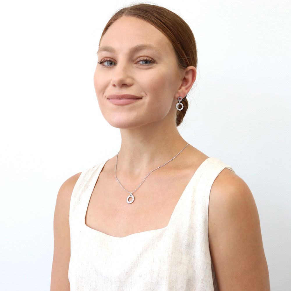 Model wearing Open Circle Cable Woven Earrings in Sterling Silver, 5 of 6
