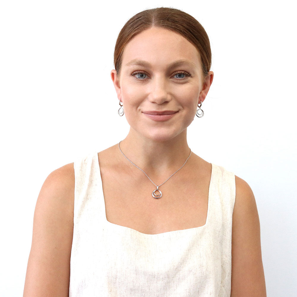 Model wearing Open Circle Necklace and Earrings in Sterling Silver, 2 of 12