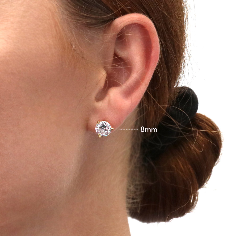 Model wearing Solitaire Round CZ Stud Earrings in Gold Flashed Sterling Silver, 10 of 15