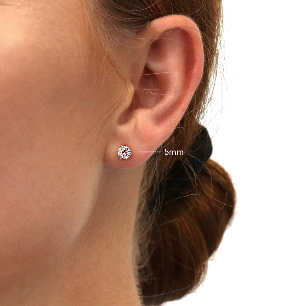 Model wearing Solitaire Round CZ Stud Earrings in Gold Flashed Sterling Silver, 13 of 15