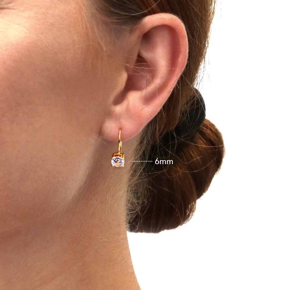 Model wearing Solitaire Round CZ Leverback Earrings in Gold Flashed Sterling Silver, 2 of 12
