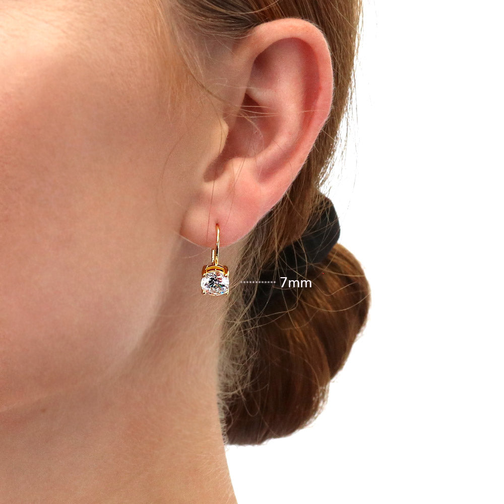 Model wearing Solitaire Round CZ Leverback Earrings in Gold Flashed Sterling Silver, 8 of 12