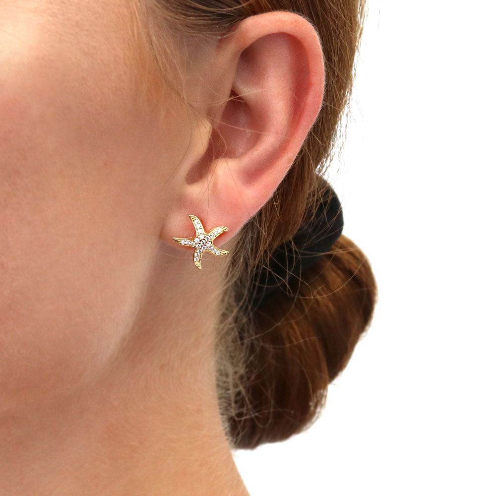 Model wearing Starfish CZ Stud Earrings in Sterling Silver, 2 of 12
