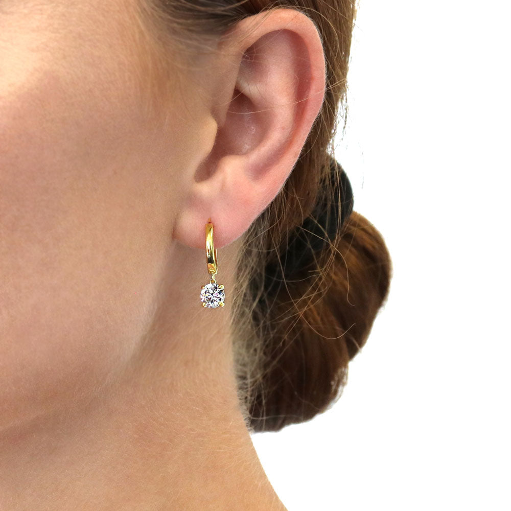 Model wearing Solitaire 1.6ct Round CZ Dangle Earrings in Sterling Silver, 2 of 9