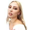 Model wearing CZ Small Inside-Out Hoop Earrings in Sterling Silver 1 inch, Yellow Gold Flashed