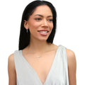 Model wearing Solitaire CZ Stud Earrings in Sterling Silver, 4mm