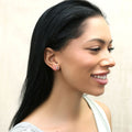 Model wearing Crescent Moon Cartilage Stud Earrings in Sterling Silver, Yellow Gold Flashed