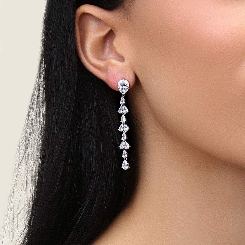 Model wearing Teardrop CZ Statement Chandelier Earrings in Sterling Silver, 2 of 10