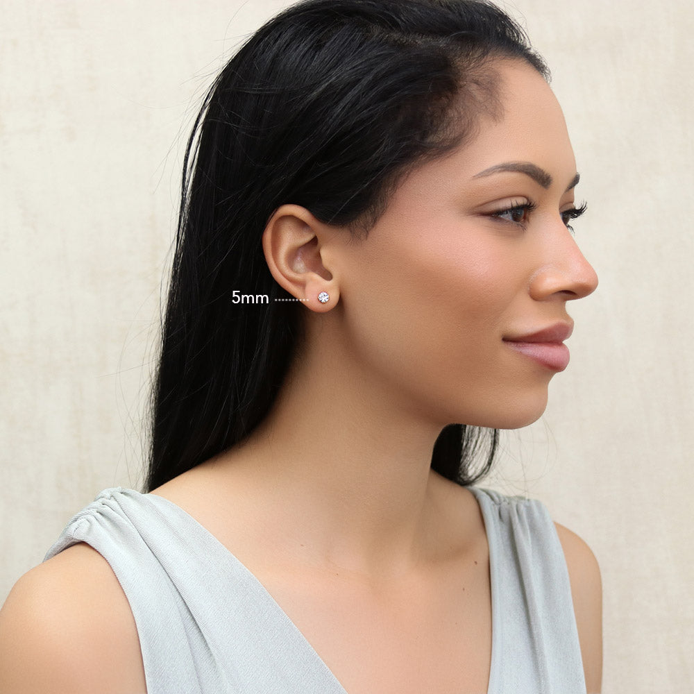 Model wearing Solitaire Round CZ Stud Earrings in Gold Flashed Sterling Silver, 7 of 14