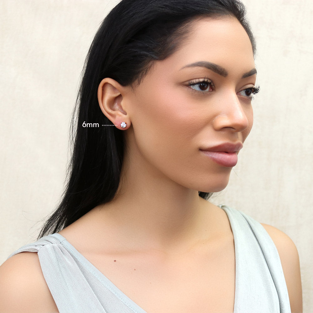 Model wearing Solitaire Round CZ Stud Earrings in Gold Flashed Sterling Silver, 11 of 14