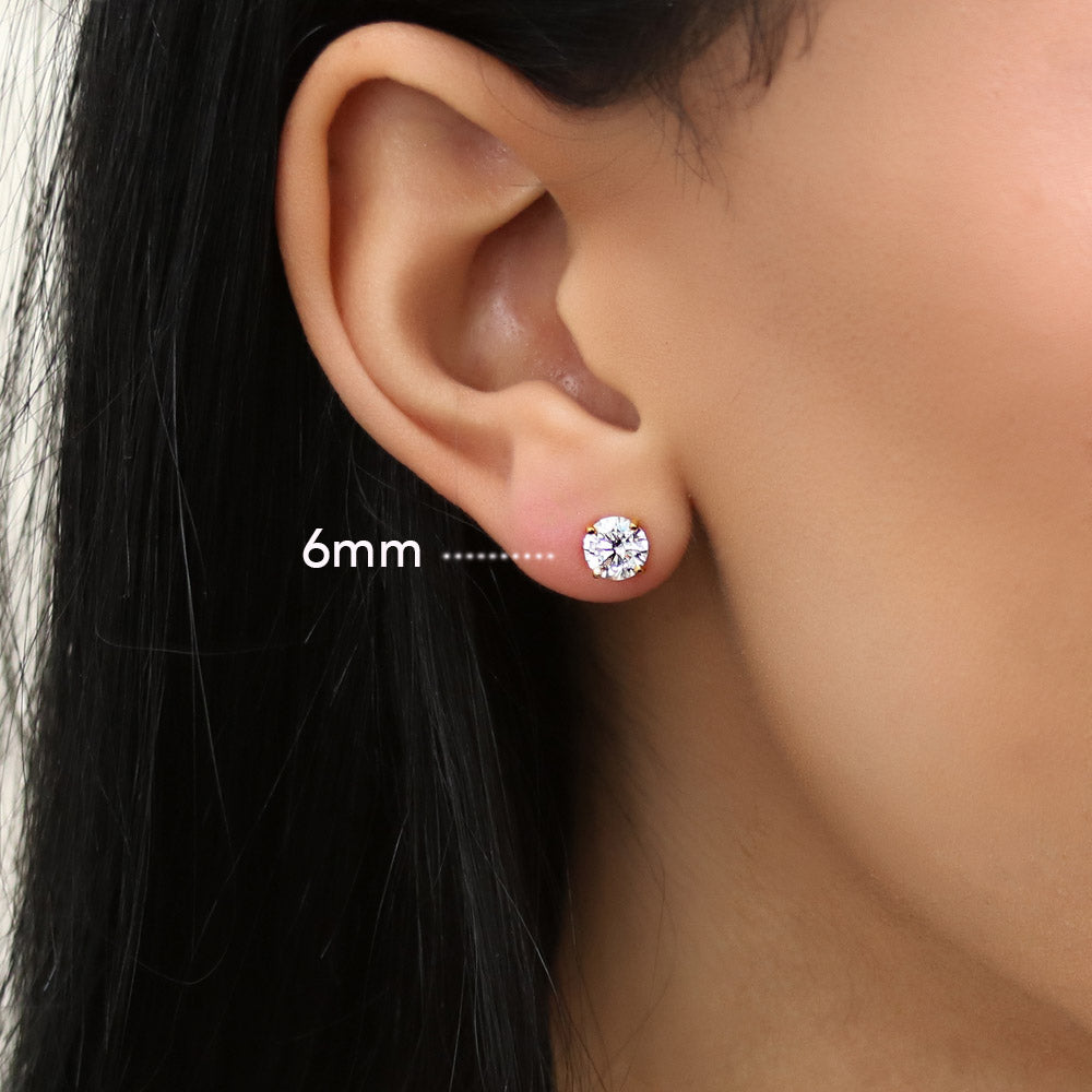 Model wearing Solitaire Round CZ Stud Earrings in Gold Flashed Sterling Silver, 8 of 14