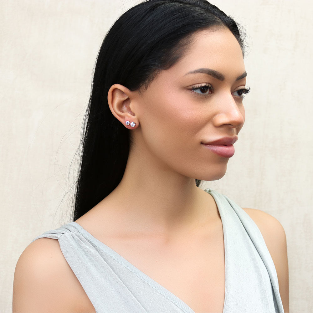 Model wearing Solitaire Round CZ Stud Earrings in Gold Flashed Sterling Silver, 13 of 14