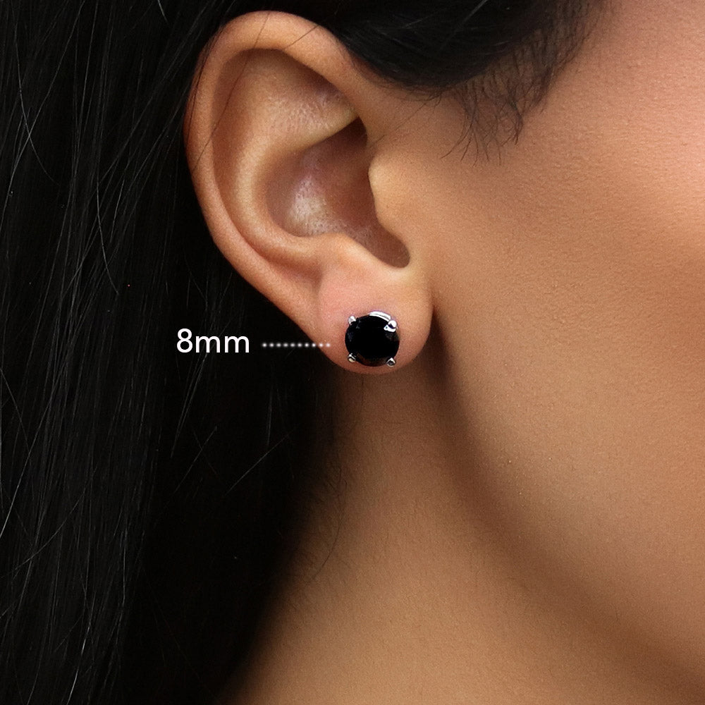 Model wearing Solitaire Black Round CZ Stud Earrings in Sterling Silver, 5 of 9