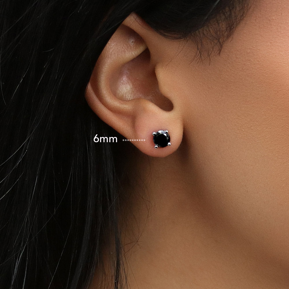 Model wearing Solitaire Black Round CZ Stud Earrings in Sterling Silver, 7 of 9