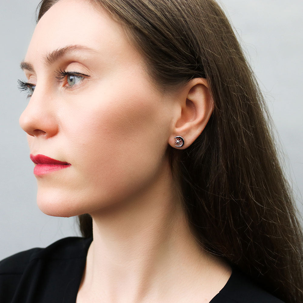 Model wearing Crescent Moon North Star Stud Earrings in Sterling Silver, 4 of 8