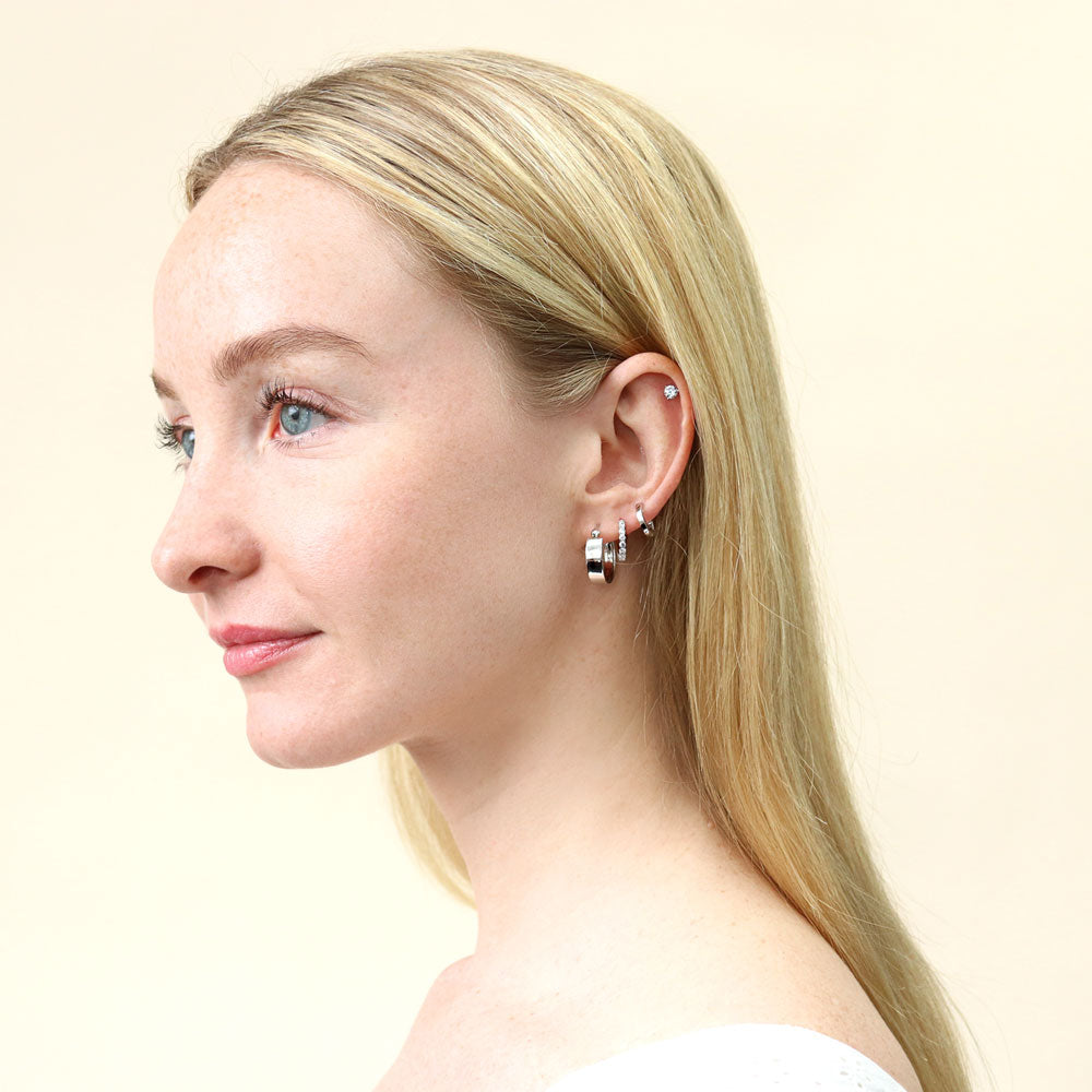 Model wearing Mini Huggie Earrings in Sterling Silver 0.45 inch, 9 of 10