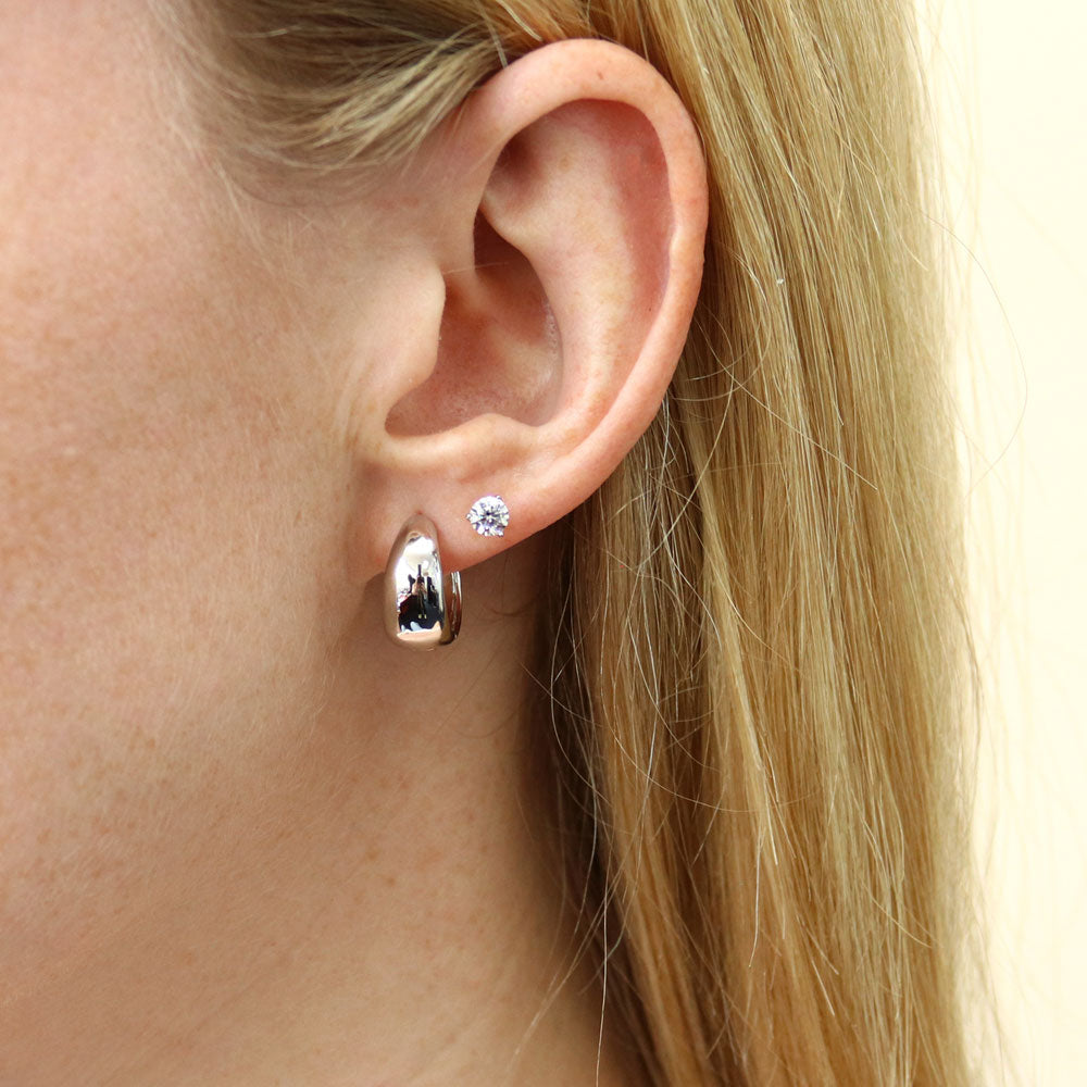 Model wearing Dome Huggie Earrings in Sterling Silver, 2 Pairs, 17 of 18