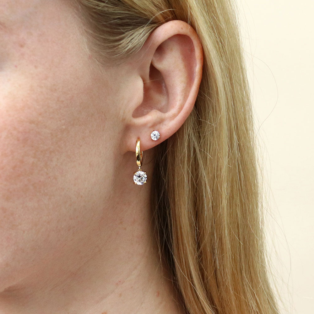 Model wearing Solitaire 1.6ct Round CZ Dangle Earrings in Sterling Silver, 7 of 9