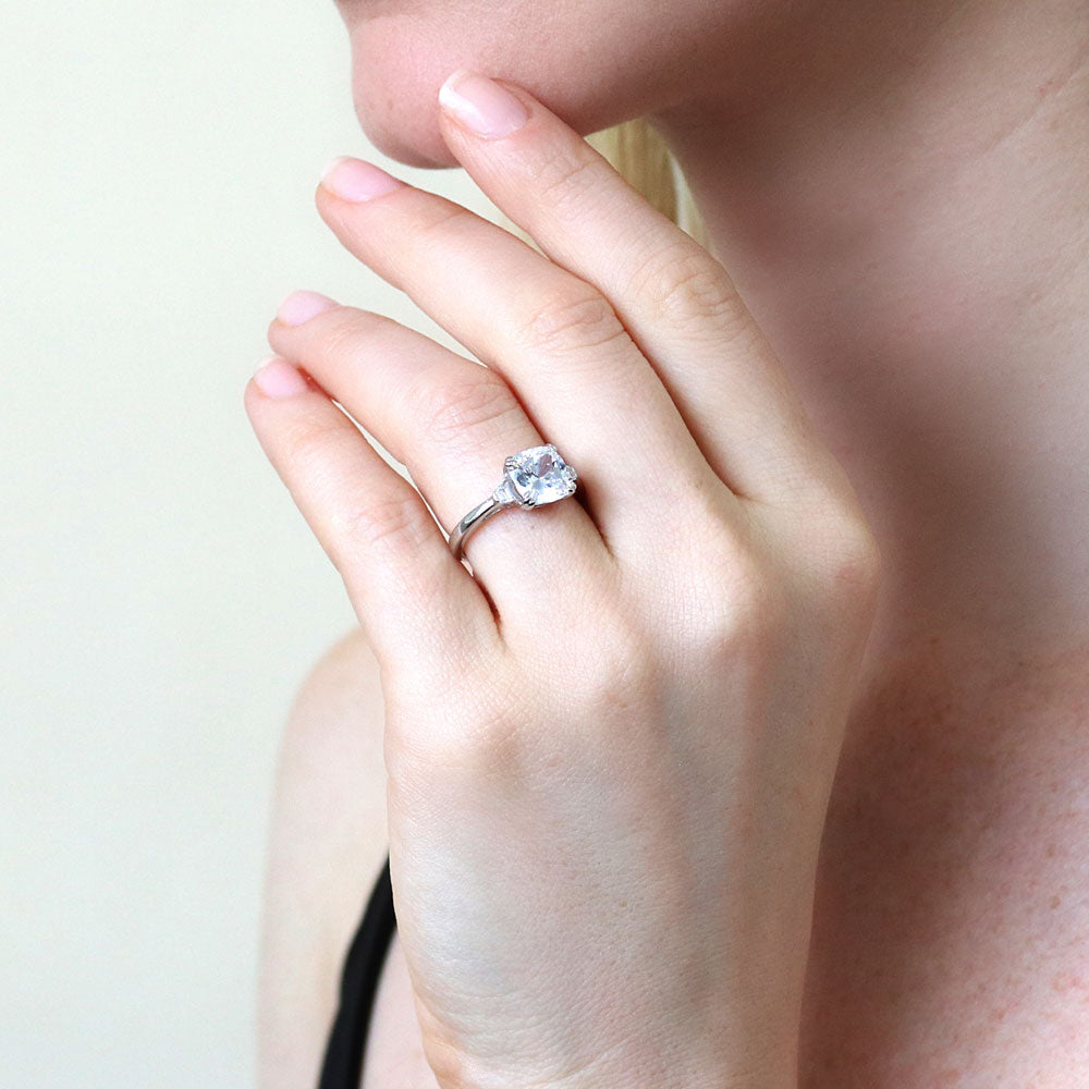 Model wearing 3-Stone 3ct Cushion CZ Ring in Sterling Silver, 7 of 9