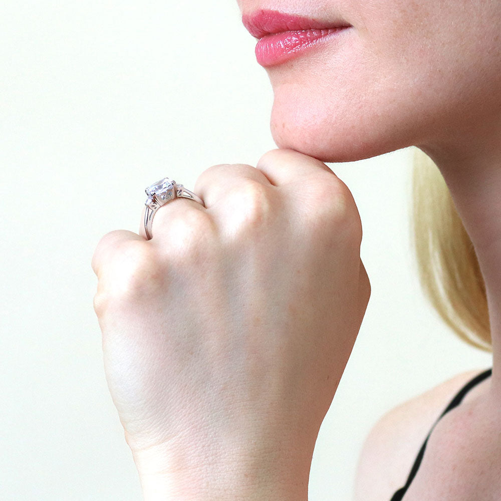 Model wearing 3-Stone Cushion CZ Ring in Sterling Silver, 3 of 9