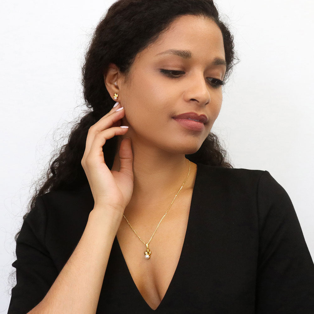 Model wearing Leaf Imitation Pearl Stud Earrings in Sterling Silver, Yellow Gold Flashed