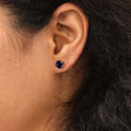 Model wearing Solitaire 1.6ct CZ Cartilage Stud Earrings in Sterling Silver, Sapphire Color