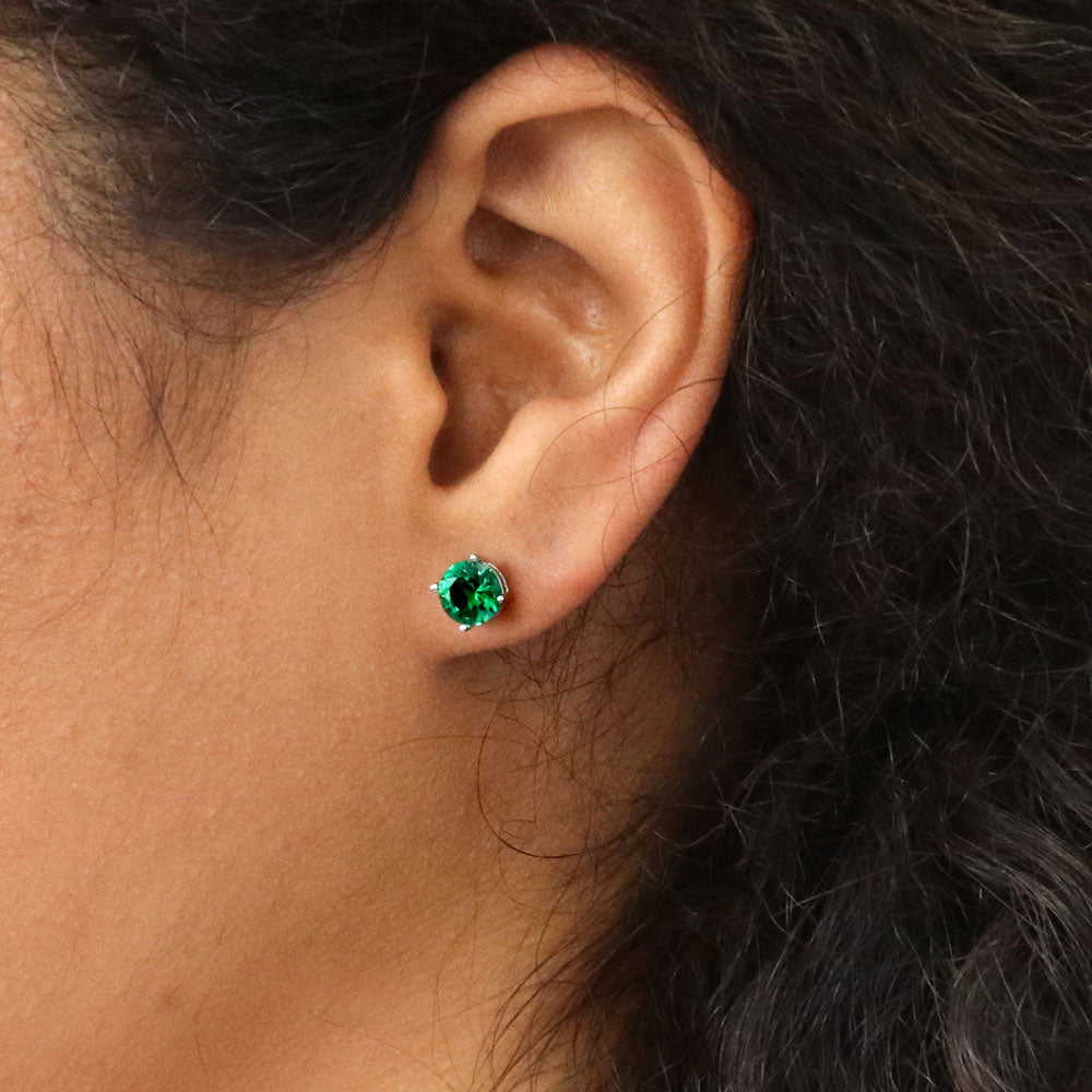 Model wearing Solitaire 1.6ct CZ Cartilage Stud Earrings in Sterling Silver, Emerald Color