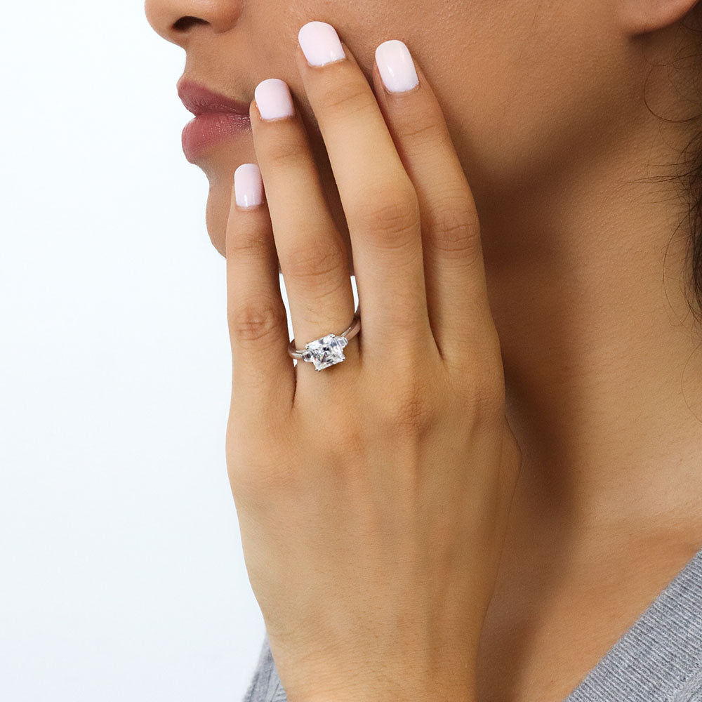Model wearing 3-Stone 2ct Princess CZ Ring in Sterling Silver, 2 of 8