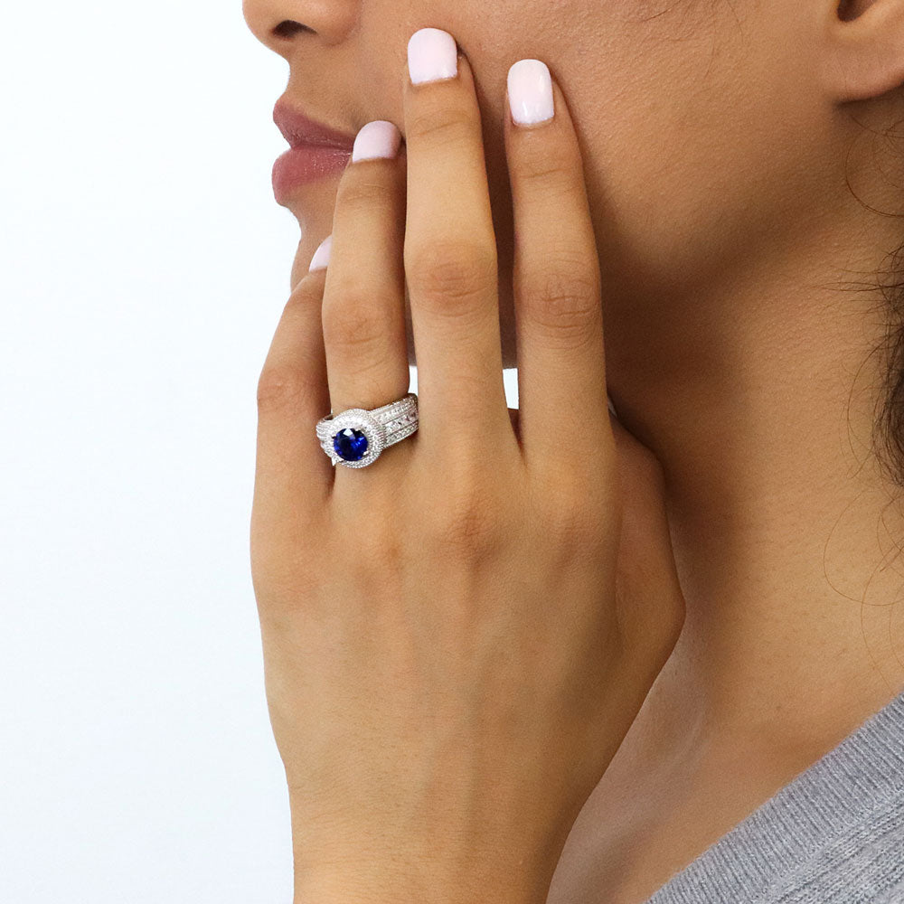 Model wearing Halo Milgrain Simulated Blue Sapphire Round CZ Ring in Sterling Silver, 2 of 14