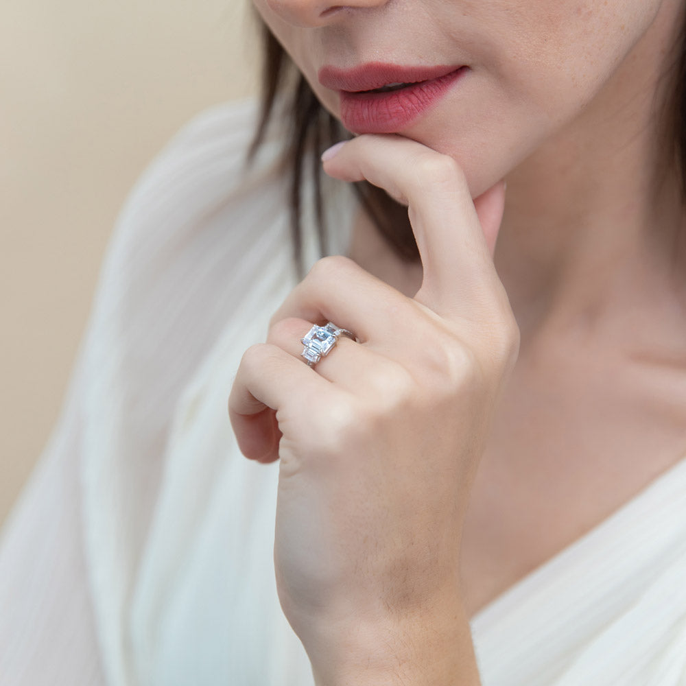 Model wearing 3-Stone 2.1ct Emerald Cut CZ Ring in Sterling Silver, 7 of 10