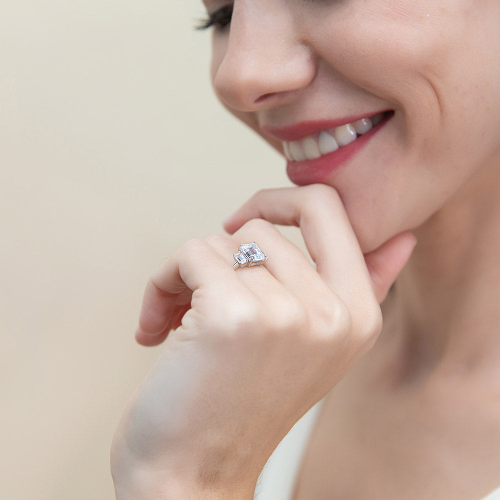 Model wearing 3-Stone 2.1ct Emerald Cut CZ Ring in Sterling Silver, 7 of 9
