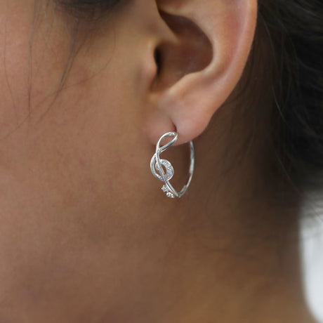 Image Contain: Model Wearing Treble Clef Music Note Hoop Earrings