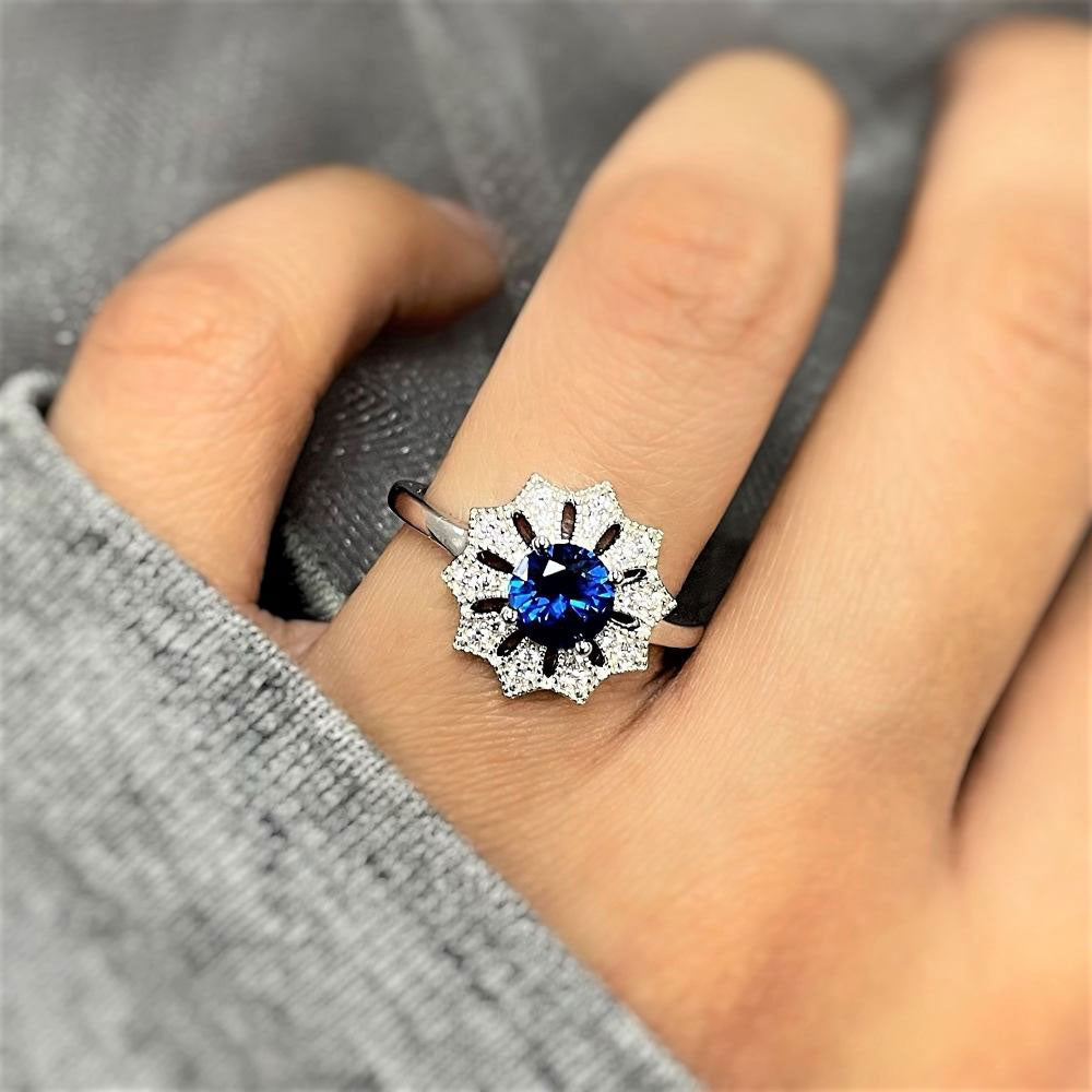 Model wearing Flower Halo Blue CZ Ring in Sterling Silver, 6 of 12