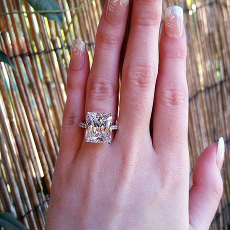 Model Wearing Solitaire with Side Stones Ring