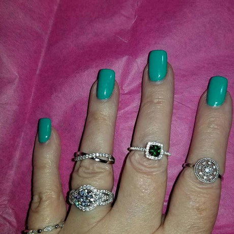 Model Wearing 3-Stone Ring, Bead Eternity Ring, Halo Ring, Infinity Ring, Medallion Ring