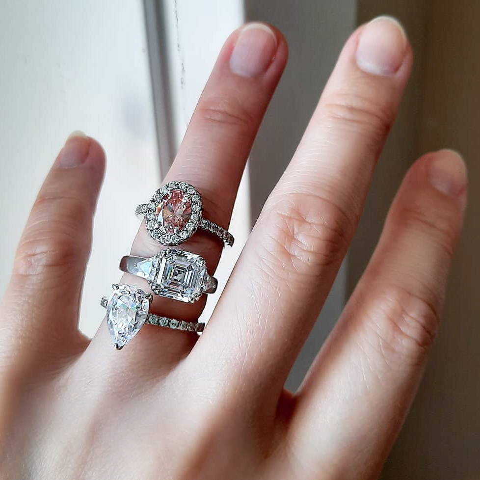 Image Contain: Model Wearing 3-Stone Ring, Halo Ring, Solitaire with Side Stones Ring