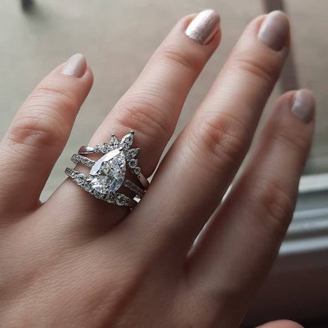 Model Wearing 5-Stone Curved Half Eternity Ring, Flower Curved Band, Solitaire with Side Stones Ring