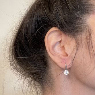 Model Wearing Solitaire Dangle Earrings