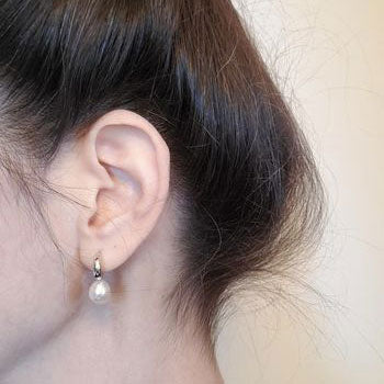 Model Wearing Solitaire Stud Earrings Style E1747-01